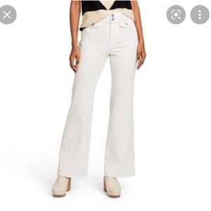creamy white jeans, with flare legs, cool little details, low rise, size 0